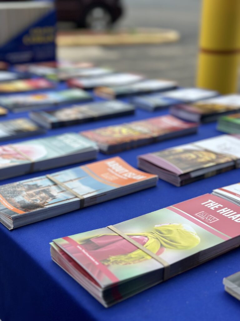 Islamic literature laid out on a dawah booth table
